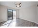 The bedroom boasts lots of natural light, wood-look floors, and a ceiling fan at 230 Moree Loop # 4, Winter Springs, FL 32708