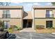 Exterior view of the building complex with stairs to the units above at 230 Moree Loop # 4, Winter Springs, FL 32708