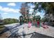 Fenced-in playground with multiple play structures offering swings and slides for active outdoor fun at 230 Moree Loop # 4, Winter Springs, FL 32708