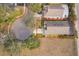 Aerial image outlining property lines to emphasize the spacious lot size and landscaping at 2551 Bear Creek Ct, Kissimmee, FL 34747