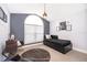 Bedroom with gray walls, modern furniture and a window letting in natural light at 2551 Bear Creek Ct, Kissimmee, FL 34747