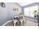 Dining area with gray walls, breakfast nook, and large window providing ample light at 2551 Bear Creek Ct, Kissimmee, FL 34747