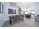 This dining area showcases modern decor, a sleek table set, and an open layout connected to the kitchen at 2551 Bear Creek Ct, Kissimmee, FL 34747