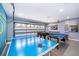 Bright, spacious game room featuring ping pong table, pool table, and foosball at 2551 Bear Creek Ct, Kissimmee, FL 34747