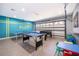 Spacious game room equipped with a pool table, ping pong, and foosball table at 2551 Bear Creek Ct, Kissimmee, FL 34747