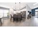 Bright, open kitchen features a center island, white cabinets, and stainless steel appliances at 2551 Bear Creek Ct, Kissimmee, FL 34747
