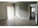 Spacious bedroom with wood-look floors and access to another room at 2586 Grand Central Pkwy # 1, Orlando, FL 32839
