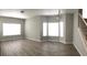 Bright dining room with bay window, wood-look flooring, and neutral walls at 2586 Grand Central Pkwy # 1, Orlando, FL 32839