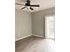 Bright living room with wood-look floors and sliding door access to balcony at 2586 Grand Central Pkwy # 1, Orlando, FL 32839