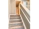 Carpeted staircase leading to the second floor of the home at 2586 Grand Central Pkwy # 1, Orlando, FL 32839