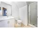 Bright bathroom featuring white cabinetry, a glass-enclosed shower, and a modern vanity, providing a clean and sleek design at 2605 Andros Ln, Kissimmee, FL 34747