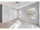 Bright bedroom with wood-look floors, large closet, and two windows creating a serene and airy space at 2605 Andros Ln, Kissimmee, FL 34747