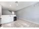 Open concept kitchen with white cabinets and black appliances at 2605 Andros Ln, Kissimmee, FL 34747