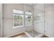 Bathroom with glass shower, tile flooring, and window at 4006 Markham Pl, Orlando, FL 32814