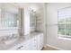 Updated bathroom with double vanity and granite countertop at 4006 Markham Pl, Orlando, FL 32814