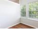 Bright bedroom with hardwood floors and two windows at 4006 Markham Pl, Orlando, FL 32814