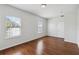 Bright bedroom with hardwood floors and two windows at 4006 Markham Pl, Orlando, FL 32814