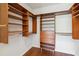 Walk-in closet with wooden shelving and drawers at 4006 Markham Pl, Orlando, FL 32814