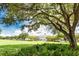Lovely community green space with mature oak trees and manicured lawns at 4006 Markham Pl, Orlando, FL 32814