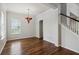 Spacious dining room with hardwood floors and elegant chandelier at 4006 Markham Pl, Orlando, FL 32814