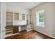 Bright home office with built-in shelving and hardwood floors at 4006 Markham Pl, Orlando, FL 32814