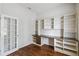 Home office features built-in shelving and hardwood floors at 4006 Markham Pl, Orlando, FL 32814
