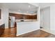 Kitchen features island, stainless steel appliances, and hardwood floors at 4006 Markham Pl, Orlando, FL 32814
