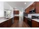Modern kitchen with stainless steel appliances and wood cabinets at 4006 Markham Pl, Orlando, FL 32814
