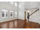 Living room with hardwood floors, high ceilings and staircase at 4006 Markham Pl, Orlando, FL 32814