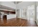 Open living area with hardwood floors, high ceilings, and kitchen views at 4006 Markham Pl, Orlando, FL 32814