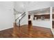 Two-story living room with hardwood floors and kitchen access at 4006 Markham Pl, Orlando, FL 32814