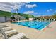 Resort-style pool with lounge chairs and a charming pool house at 4006 Markham Pl, Orlando, FL 32814