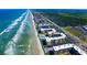 Panoramic aerial view of the coastline showcasing the building's ideal oceanfront location and accessibility at 4175 S Atlantic Ave # 232, New Smyrna Beach, FL 32169