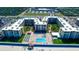 Bird's eye view of the complex showing multiple buildings, beach access, pool and recreational shuffleboard area at 4175 S Atlantic Ave # 232, New Smyrna Beach, FL 32169