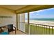 Screened in balcony featuring furniture and a view of the beach at 4175 S Atlantic Ave # 232, New Smyrna Beach, FL 32169