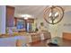 Dining room with a view of the open kitchen concept, stylish lighting and decor at 4175 S Atlantic Ave # 232, New Smyrna Beach, FL 32169