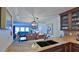 Kitchen featuring custom wood cabinets, stainless steel appliances, and tile backsplash at 4175 S Atlantic Ave # 232, New Smyrna Beach, FL 32169