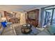 Living room with open view to the dining and kitchen areas, and access to outdoor patio at 4175 S Atlantic Ave # 232, New Smyrna Beach, FL 32169