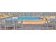A refreshing swimming pool surrounded by lounge chairs and tables, perfect for relaxation at 4175 S Atlantic Ave # 232, New Smyrna Beach, FL 32169
