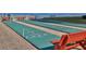 Multiple shuffleboard courts surrounded by benches, inviting friendly competition and outdoor enjoyment at 4175 S Atlantic Ave # 232, New Smyrna Beach, FL 32169