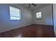 Roomy bedroom with wood-look floors and dual windows at 421 Sw 23Rd St, Ocala, FL 34471
