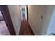 Long hallway with wood flooring at 421 Sw 23Rd St, Ocala, FL 34471
