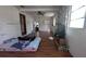 Living room with wood flooring, fireplace, and sleeping area at 421 Sw 23Rd St, Ocala, FL 34471