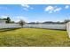 Large, fenced backyard featuring a well-maintained lawn and ample space at 514 Eagle Landing Blvd, Winter Haven, FL 33880