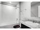 Well-lit bathroom featuring a shower over tub and single vanity sink at 514 Eagle Landing Blvd, Winter Haven, FL 33880