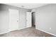 Cozy bedroom with plush carpet and white doors, offering a peaceful retreat at 514 Eagle Landing Blvd, Winter Haven, FL 33880