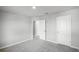 Bedroom featuring neutral paint and carpet, with an open door to an adjoining space at 514 Eagle Landing Blvd, Winter Haven, FL 33880