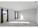 Bright bedroom featuring neutral colored walls, carpeted floors, and sunny window at 514 Eagle Landing Blvd, Winter Haven, FL 33880