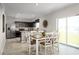Dining area and kitchen with stainless steel appliances, and modern countertops at 514 Eagle Landing Blvd, Winter Haven, FL 33880