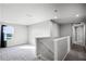 Hallway with stairs and a view to the outside through a bright window at 514 Eagle Landing Blvd, Winter Haven, FL 33880